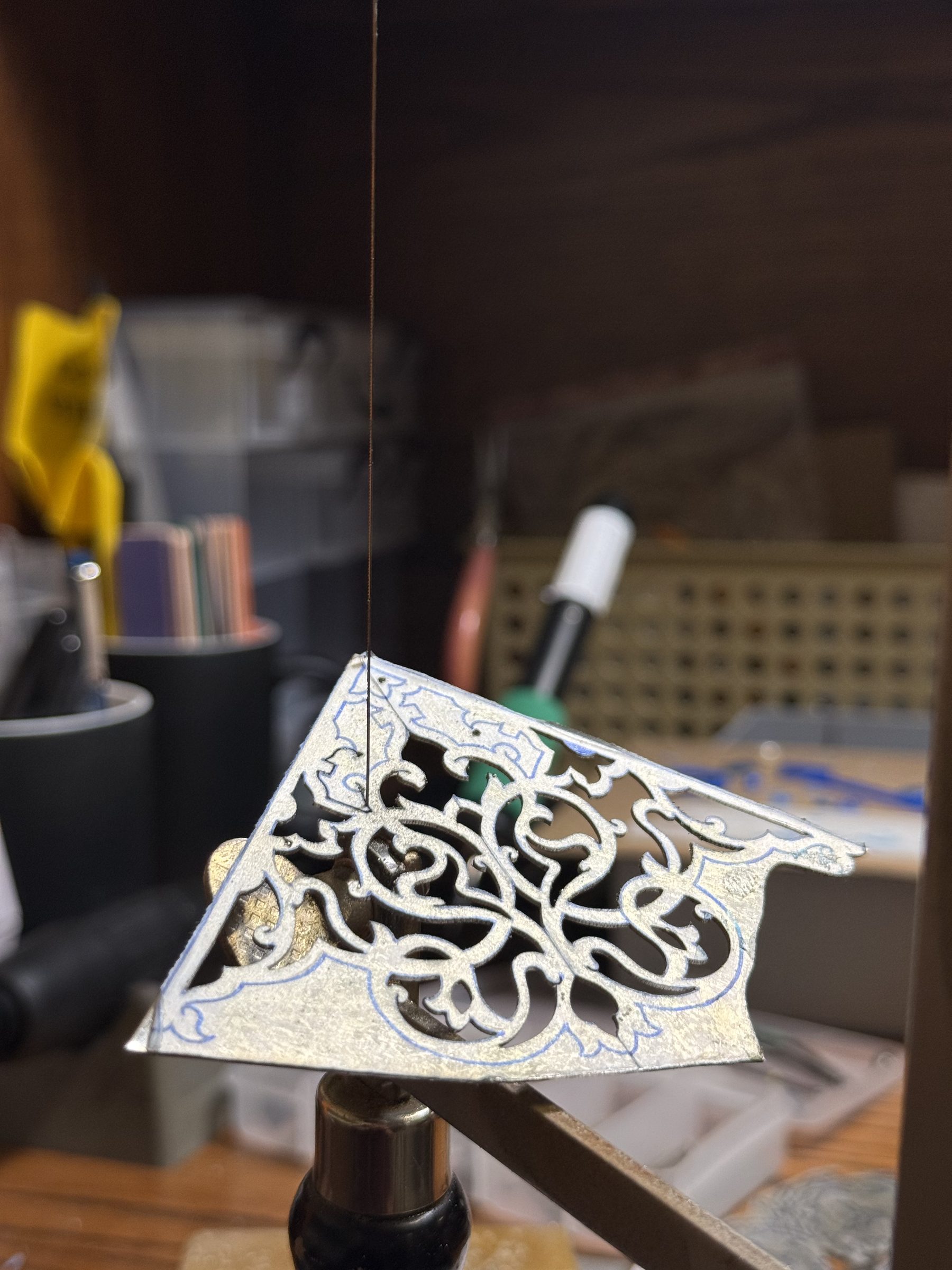 Inside the studio: tools, jewelry in process, materials at hand.
