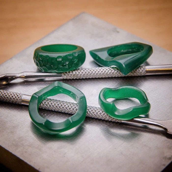 Wax-carved rings in process before casting into metal.