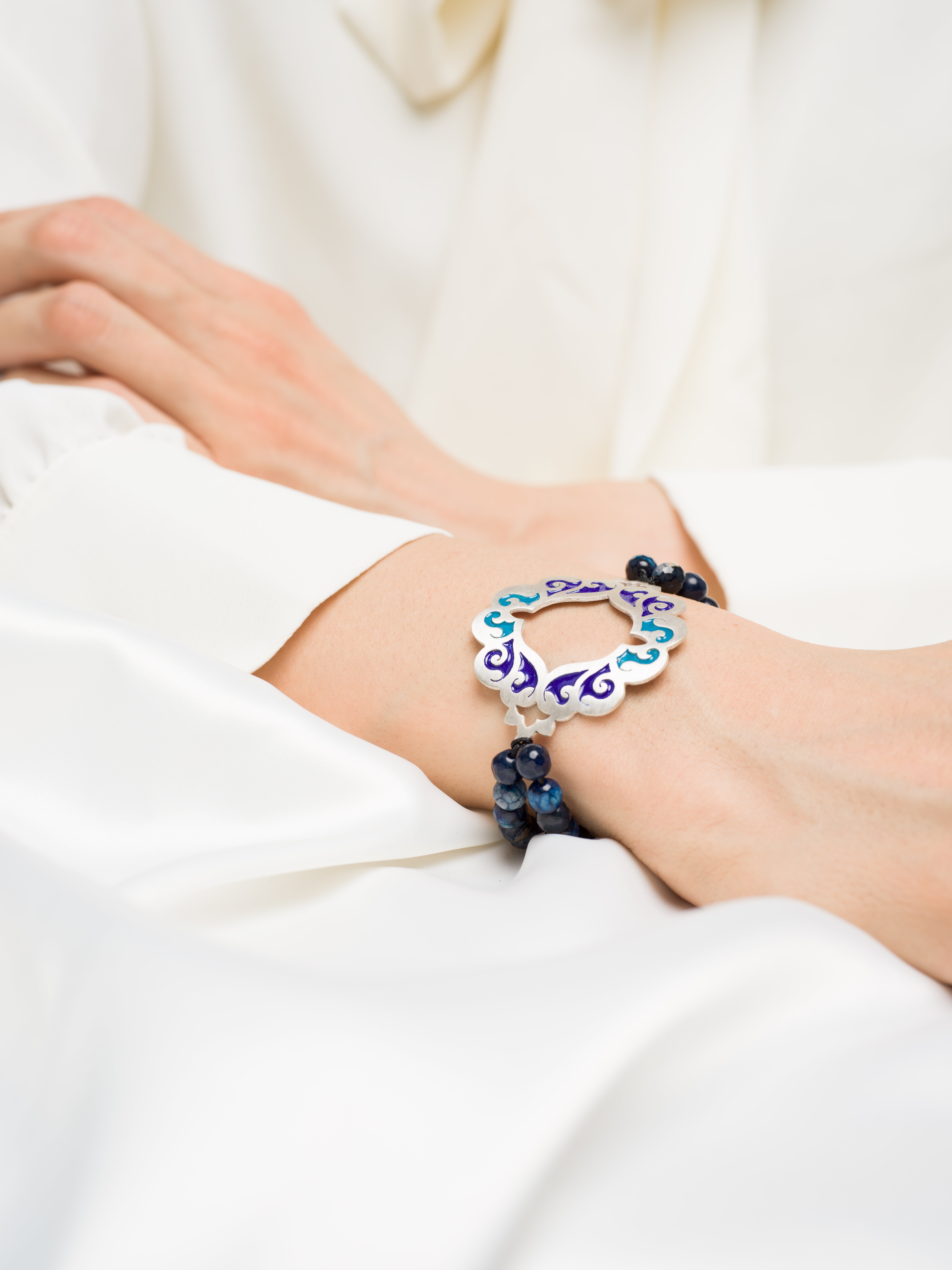 Persian Carpet collection showcasing ongoing designs with silver and enamel